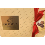 Godiva chocolate gift box with red ribbon and assorted chocolates