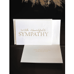 White sympathy card with gold lettering and butterfly embossing