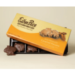 Box of caramel pecan milk chocolates with an open tray displaying several chocolates.