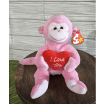 Pink plush monkey holding a red heart that says I Love You