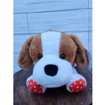 Plush dog toy with brown and white fur and red paw pads