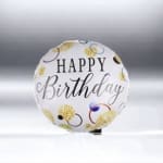 Round birthday balloon with gold confetti pattern