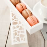 Box of assorted macarons on a table