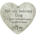 Heart-shaped memorial stone for a beloved dog with paw prints