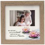 Wooden photo frame with a memorial quote and pink lotus flowers