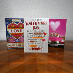 Three Valentine’s Day greeting cards standing on a table