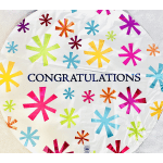 Round congratulations balloon with colorful starburst pattern