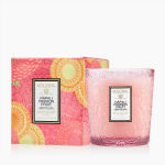 Pink Voluspa candle in a textured glass jar with matching box