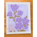 Purple floral card with stylized blossoms on a lavender background