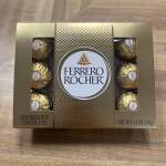Box of Ferrero Rocher chocolates on a wooden surface