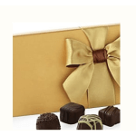 Gift box with a gold ribbon and assorted chocolates