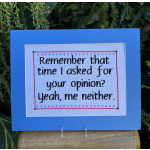 Framed cross-stitch quote on a blue card
