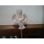 White ceramic angel figurine on a stick