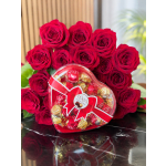 Red roses with a heart-shaped box of chocolates tied with a red ribbon