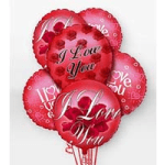 Cluster of red heart-shaped balloons with love messages