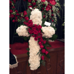 Floral cross arrangement with white blooms and red roses