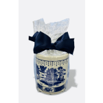 Wrapped decorative candle with a navy bow