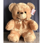Tan teddy bear with a satin ribbon and tag