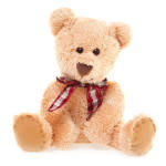 Plush teddy bear with a red plaid ribbon bow