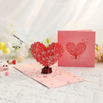 Pop-up card with a red floral heart and pink cover