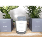 Soy candle in a glass jar with two matching boxes beside it