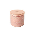 Pink candle in a glass jar with a rose-gold lid