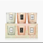 Set of three scented candles in frosted glass holders with pastel packaging