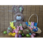 Plush bunny with colorful Easter eggs and a basket of eggs