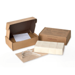 Candle making kit with wax blocks, wicks, and cardboard boxes