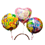 Three colorful foil balloons reading Good Luck, It's a Girl, and Happy Birthday