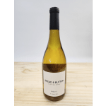 Bottle of Bread & Butter Chardonnay on a wooden surface