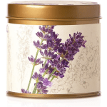 Gold tin candle with a lavender floral label