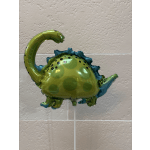 Green dinosaur-shaped foil balloon on a stick