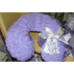 Lavender plush U-shaped neck pillow with ribbon tags