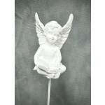 White angel figurine holding an open book on a stick