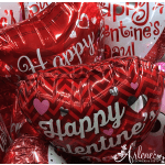 Red heart-shaped Valentine balloons with white lettering
