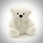 White teddy bear with a ribbon bow