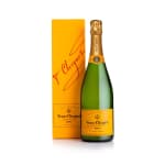 Bottle of Veuve Clicquot champagne beside its yellow box