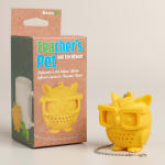 Yellow owl-shaped tea infuser beside its retail box
