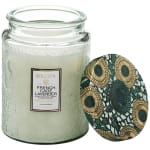 Glass jar candle with a patterned lid