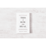 A book titled "This Is How You Heal" on a white wooden surface