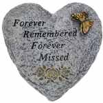 Heart-shaped memorial stone with butterfly and floral accents