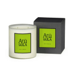 White jar candle with a black box behind it