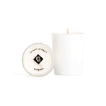 White candle in a glass jar with a lid beside it