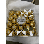 Box of Ferrero Rocher chocolates in gold wrappers