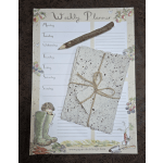 Weekly planner with a twig pencil and tied handmade paper cards