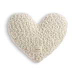 Heart-shaped knitted pillow in cream with a small label