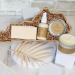 Gift basket with soap, lotion, and candles in a woven tray