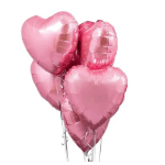 Cluster of shiny pink heart-shaped foil balloons on strings