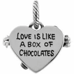 Heart-shaped charm with the words "Love is like a box of chocolates"